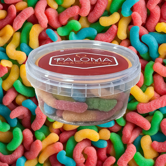 Clear plastic container of colorful gummy candies labeled ’Paloma Nuts & Confectionery’.