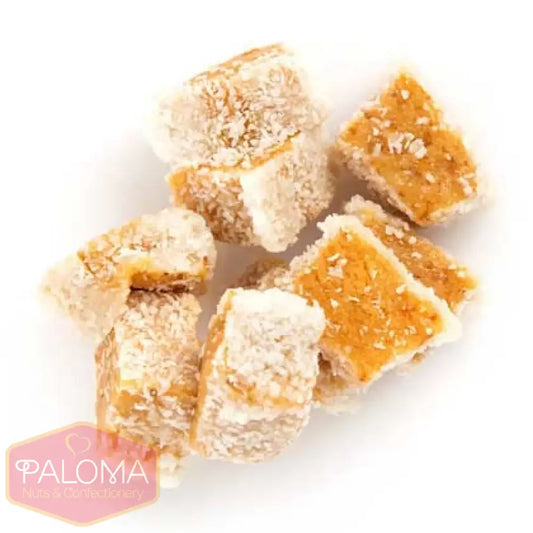 Cubes of Turkish delight coated in powdered sugar and coconut.