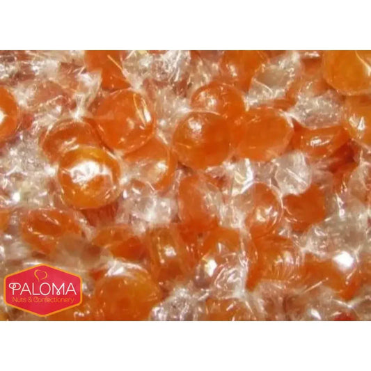 Orange hard candies individually wrapped in clear plastic.