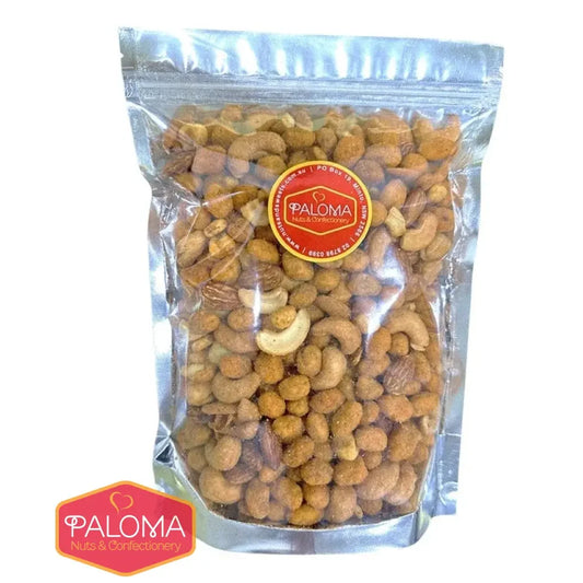 Clear plastic bag filled with mixed nuts, labeled with a Paloma brand sticker.