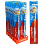 Colgate toothbrushes displayed in a retail packaging stand.