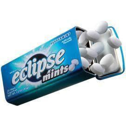 A pack of Eclipse mints with some mints spilling out.