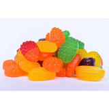 Colorful assortment of fruit-shaped gummy candies.