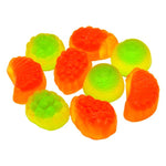 Colorful fruit-shaped gummy candies in green, orange, and yellow hues.