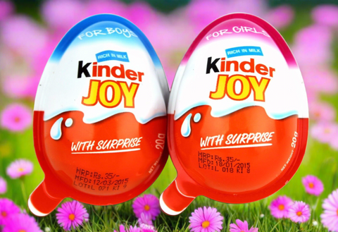 Two Kinder Joy chocolate eggs, one labeled ’For Boys’ and one ’For Girls’, with colorful packaging.