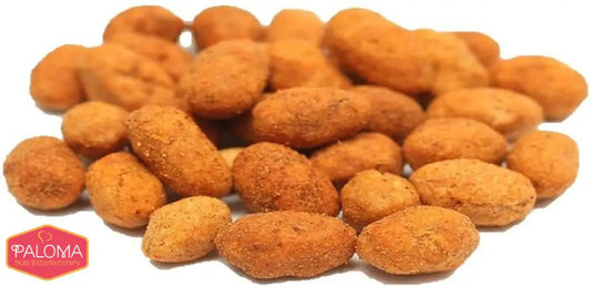 Pile of golden-brown, oval-shaped peanuts with a textured surface.