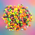 Colorful assortment of small, round candies or sweets.