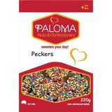 Colorful candy-coated chocolate buttons called ’Peckers’ in a Paloma brand package.