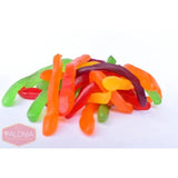 Colorful gummy worms candy in various shapes and hues.