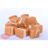 Cubes of caramel candy with visible layers.