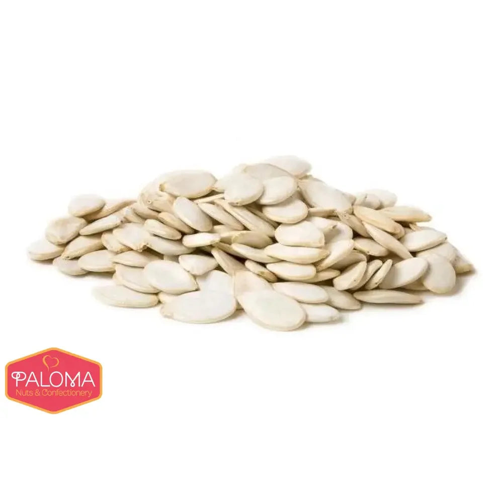 A pile of white, flat, oval-shaped pumpkin seeds.