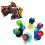 Colorful plastic ring pops candy with jewel-shaped tops.