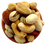 Bowl of mixed nuts including almonds, cashews, and pistachios.