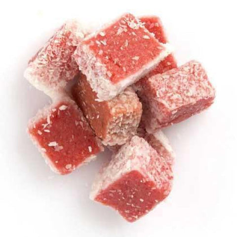 Cubes of Turkish delight coated in powdered sugar.