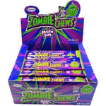 Display box containing multiple packages of ’Zombie Chews’ candy in vibrant purple and green packaging.