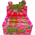 Display box of ’Zombie Chews’ candy in bright pink packaging featuring a cartoon zombie head.